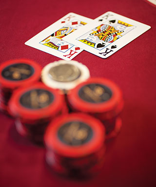chips and 2 cards on red table 2