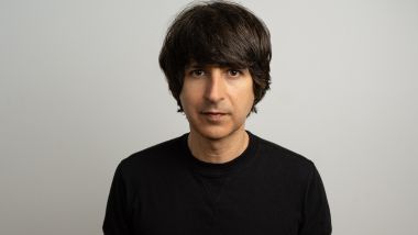 A close up image of Demetri Martin
