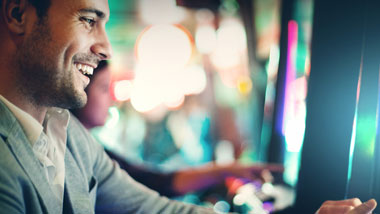 man playing slot machine