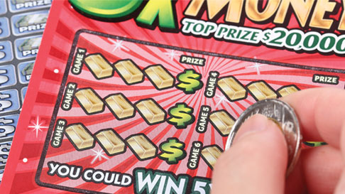scratching off a lottery ticket