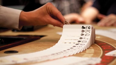 dealer shuffling cards