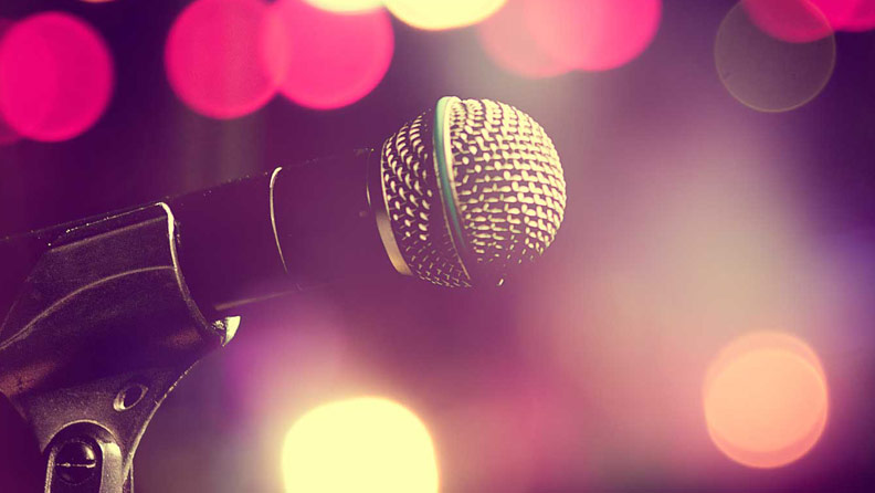 microphone with blurred lights in the background